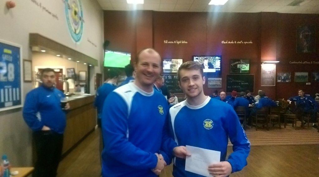1st Team Manager Michael Dunwell handing over the December Player of the Month Award.