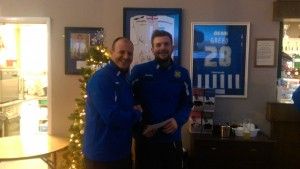 Captain Stav Roberts collecting his "Peking Garden Player of the Month Award" from 1st Team Manager Michael Dunwell.